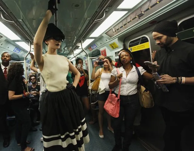 A model presents a creation in a subway station during the Sao Paulo Fashion Week in Sao Paulo October 27, 2013. (Photo by Paulo Whitaker/Reuters)