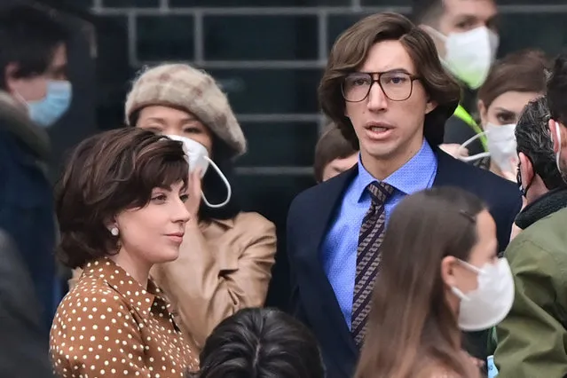 US singer, songwriter and actress Lady Gaga (L) and US actor Adam Driver (R) are pictured on March 11, 2021 on Piazza Duomo in central Milan on the set of the new Ridley Scott movie about the Gucci “Black Widow” Patrizia Reggiani, who was tried and convicted of orchestrating the assassination of her ex-husband and former head of the Gucci fashion house Maurizio Gucci. “House of Gucci”, which stars Lady Gaga, Adam Driver, Al Pacino, Jared Leto, Jack Huston, Reeve Carney and Jeremy Irons, is an upcoming American biographical crime film directed by Ridley Scott, scheduled to be released in the United States on November 24, 2021 by Metro-Goldwyn-Mayer. (Photo by Miguel Medina/AFP Photo) 