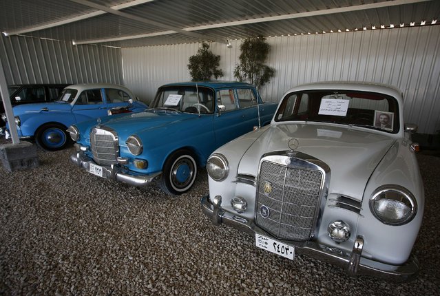 A 1957 model Mercedes-Benz (R), that used to belong to Iraq's late legendary singer Nazem al-Ghazali, is parked next to a 1967 model Mercedes-Benz at the home of an Iraqi collecter Hani al-Amiri, in the holy city of Najaf on March 16, 2015. (Photo by Haidar Hamdani/AFP Photo)
