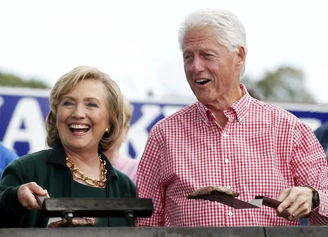 Former U.S. Secretary of State Hillary Clinton and her husband former U.S. President Bill Clinton hold up some steaks at the 37th Harkin Steak Fry in Indianola, Iowa, in this September 14, 2014 file photo. (Photo by Jim Young/Reuters)