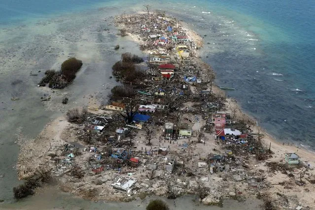 An aerial view of a coastal town, devastated by super Typhoon Haiyan, in Samar province in central Philippines November 11, 2013. (Photo by Maxim Zmeyev/Reuters)