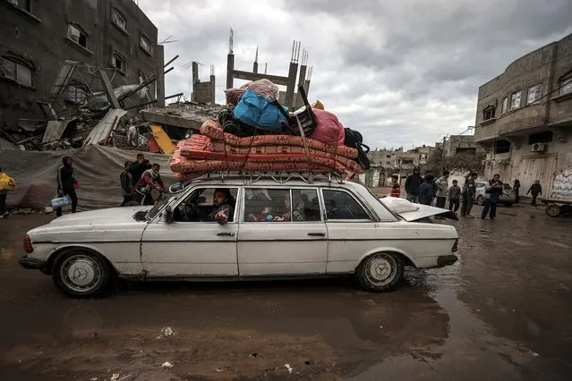 Residents leave their homes with their belongings after the Israeli army attacked the eastern part of the Nuseirat refugee camp and sent a notice asking the people to leave the area in Deir al Balah, central Gaza on January 03, 2024. Israel's air, land and sea attacks continue on the Gaza Strip. (Photo by Ali Jadallah/Anadolu via Getty Images)