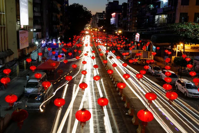 Cars drive past an street decorated with Chinese lamps to celebrate the Lunar New Year in Yangon, Myanmar January 25, 2017. (Photo by Soe Zeya Tun/Reuters)