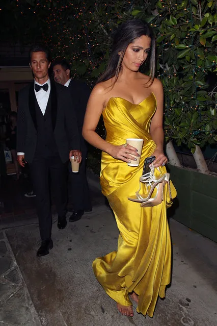 Following his big win at the 20th SAG Awards for “Outstanding Performance by a Male Actor in a Leading Role”, Matthew McConaughey and Camila Alves have dinner at Ago restaurant in West Hollywood. As they walk to their car Alves opts to go barefoot as she carries her strappy high heels. (Photo by Zavar/Raffi/NPG.com)