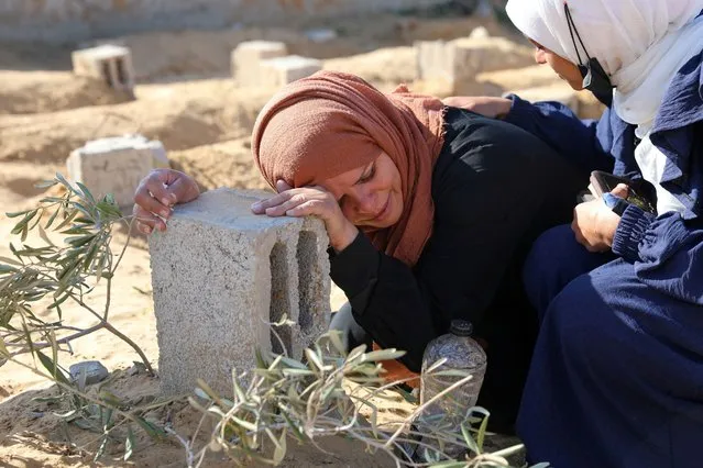 A Palestinian woman reacts at the grave of her son killed in an Israeli strike, amid the ongoing conflict between Israel and the Palistinian Islamist group Hamas, in Khan Younis in the southern Gaza Strip, on January 18, 2024. (Photo by Arafat Barbakh/Reuters)