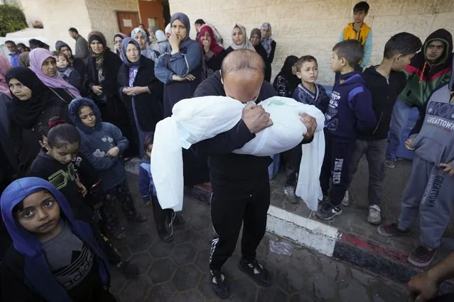 A Palestinian morns a relative killed in the Israeli bombing of the Gaza Strip in Deir al Balah, Gaza Strip, on Sunday, February 11, 2024. (Photo by Adel Hana/AP Photo)
