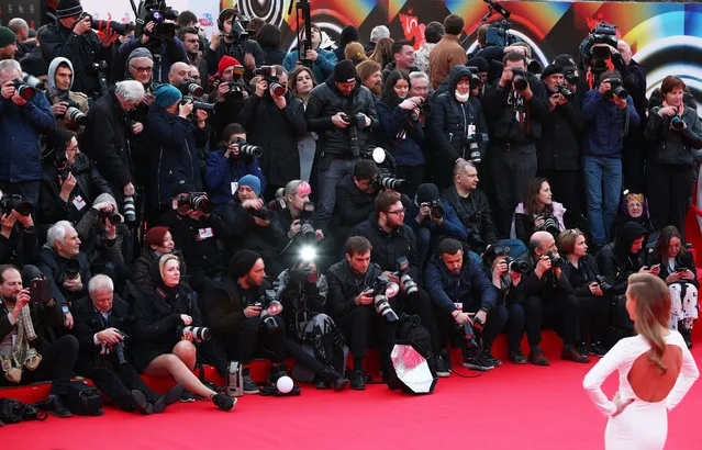 Journalists and photographers attend a ceremony to open the 2019 Moscow International Film Festival at the Rossiya Theatre in Moscow, Russia on April 18, 2019. (Photo by Mikhail Tereshchenko/TASS)