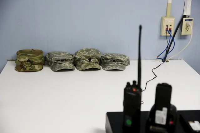 Soldiers' hats rest on a table next to radios in Joint Task Force Guantanamo's detainee hospital at the U.S. Naval Base in Guantanamo Bay, Cuba March 22, 2016. (Photo by Lucas Jackson/Reuters)