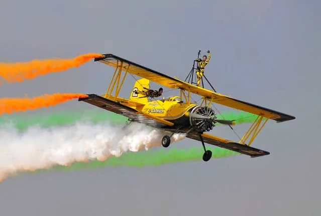 Skycat Wingwalkers from the Scandinavian Airshow perform during the inauguration of Aero India show at the Yelahanka Air Force Station in Bengaluru, India, February 14, 2017. (Photo by Abhishek N. Chinnappa/Reuters)
