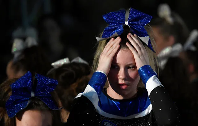 Competitors react during an awards ceremony at the Legacy Super Regional Cheer and Dance Championships at Copperbox Arena, Queen Elizabeth Olympic Park in London, Britain February 19, 2017. (Photo by Toby Melville/Reuters)