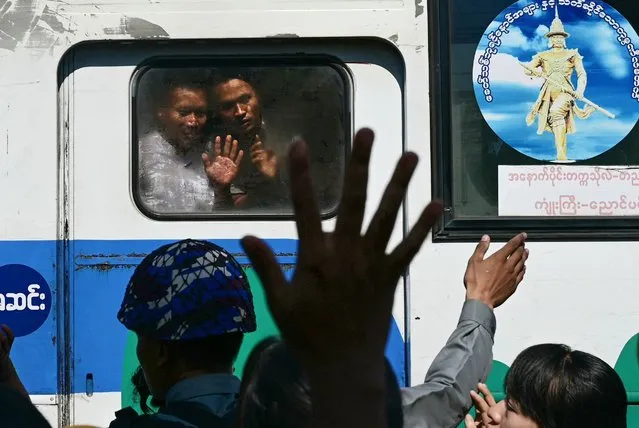 Relatives gather around a bus carrying prisoners being released from Insein prison on Myanmar’s Independence Day in Yangon on January 4, 2024. Myanmar's junta announced an amnesty for more than 9,000 prisoners on January 4, part of an annual release to mark the country's Independence Day. (Photo by AFP Photo)