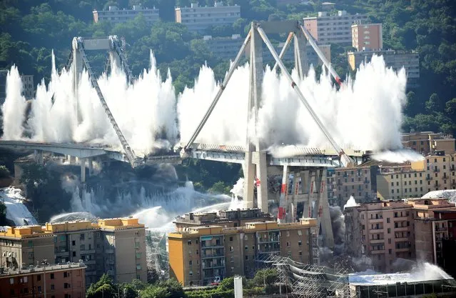 Controlled explosions demolish two of the pylons of the Morandi bridge almost one year since a section of the viaduct collapsed killing 43 people, in Genoa, Italy on June 28, 2019. (Photo by Massimo Pinca/Reuters)
