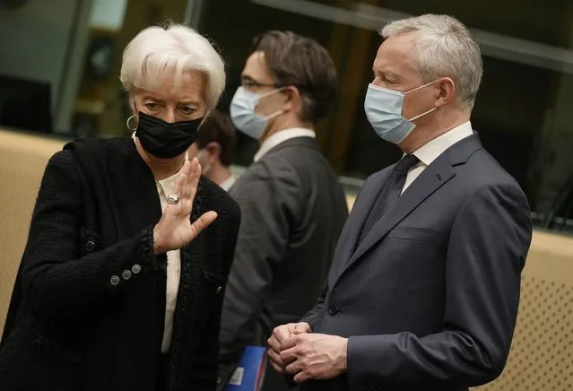 European Central Bank President Christine Lagarde, left, speaks with French Finance Minister Bruno Le Maire during a meeting of eurogroup finance ministers at the European Council building in Brussels, Monday, January 17, 2022. Euro finance chiefs hold their first meeting of 2022 in Brussels today facing a challenge that spilled over from last year: surging prices. Inflation in the 19-nation euro area has risen to a record amid an energy-market squeeze while the economic outlook for Europe has dimmed following a recovery in 2021 from the pandemic-induced recession. (Photo by Virginia Mayo/AP Photo)