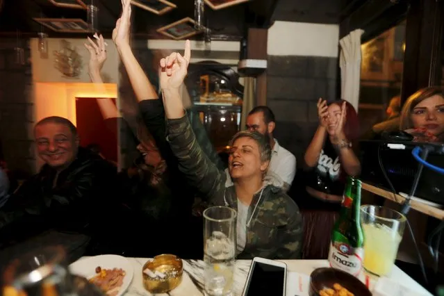 People dance at 80s Bar in Damascus, Syria, March 11, 2016. (Photo by Omar Sanadiki/Reuters)