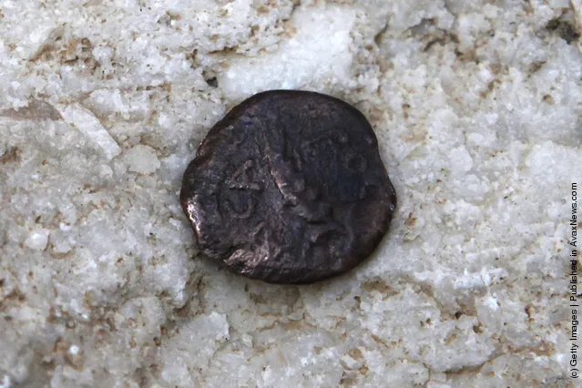 One of the two ancient bronze coins, which according to Israel Antiquities Authority archaeologists were struck by the Roman procurator of Judea, Valerius Gratus
