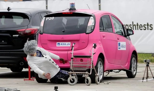 A Mitsubishi i-MiEV electric car collides with a crash test dummy with a rollator in a controlled crash test from insurer AXA, in Duebendorf, Switzerland, August 22, 2019. (Photo by Moritz Hager/Reuters)