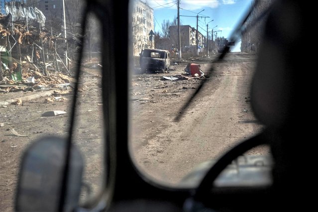A view shows an empty street and buildings damaged by a Russian military strike, as Russia's attack on Ukraine continues, in the front line city of Bakhmut, Ukraine on March 3, 2023. (Photo by Oleksandr Ratushniak/Reuters)