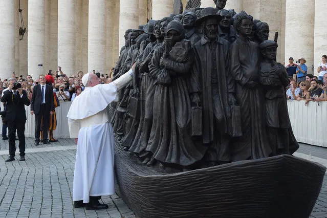 Pope Francis attends the unveiling of the sculpture called “Angels Unaware” by Canadian sculptor Timothy P. Schmalz depicting a group of 140 migrants of various cultures and from different historic times, at the end of a mass on the occasion of the World Day of Migrants in St. Peter's Square, on September 29, 2019 in Vatican City, Vatican. (Photo by Vatican Pool – Corbis/Corbis via Getty Images)