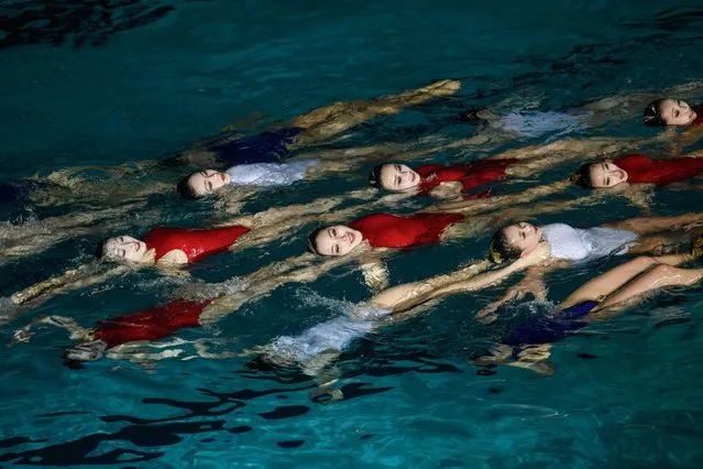 Swimmers perform in a synchronised swimming gala event celebrating late North Korean leader Kim Jong Il, in Pyongyang on February 14, 2019. (Photo by Ed Jones/AFP Photo)