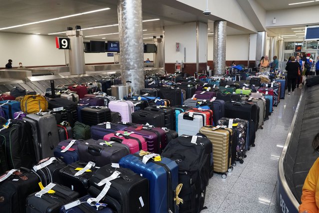 People wait to retrieve their luggage after long delays following cyber outages affecting airlines at Hartsfield-Jackson Atlanta International Airport in Atlanta, Georgia, U.S., July 22, 2024. (Photo by Megan Varner/Reuters)