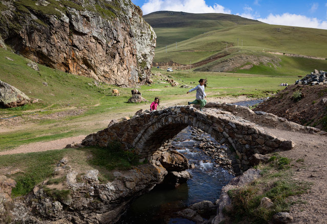 Children playing on the 2,140-meter-altitude Taskopru Plateau, which hosts both livestock breeders and nature lovers in summer months, are seen in Gumushane, Turkiye on August 22, 2024. (Photo by Ahmet Aslan/Anadolu via Getty Images)