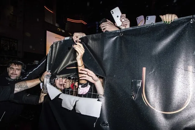 Fans of Timothee Chalamet break through signage at the premiere of the film “Dune” on Monday, October 18, 2021 in London. (Photo by Vianney Le Caer/Invision/AP Photo)