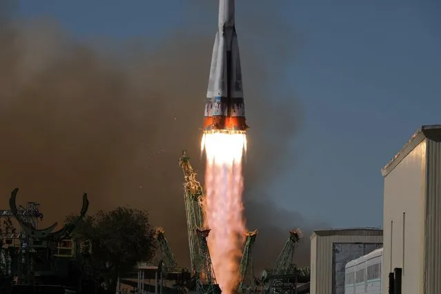 The Soyuz MS-19 spacecraft carrying the crew, formed of Russian cosmonaut Anton Shkaplerov, film director Klim Shipenko and actress Yulia Peresild, blasts off to the International Space Station (ISS) from the launchpad at the Baikonur Cosmodrome, Kazakhstan on October 5, 2021. (Photo by Roscosmos/Handout via Reuters)