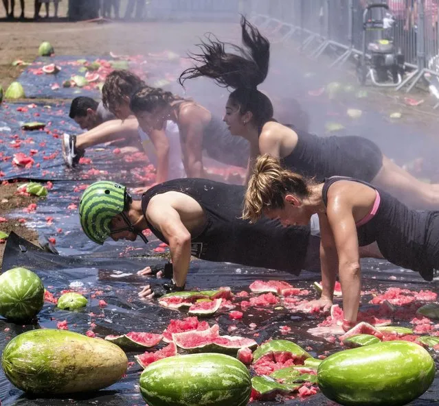 Festival-goers have gathered together to play homage to the humble watermelon during the 55th Annual Watermelon Festival in Los Angeles, California on July 29, 2017. (Photo by Xinhua News Agency/Rex Features/Shutterstock)