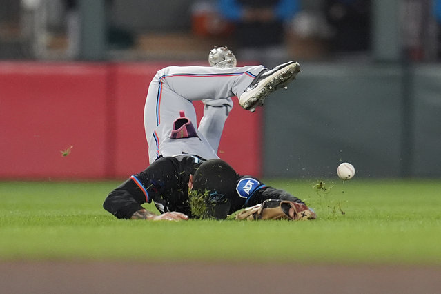 Miami Marlins center fielder Derek Hill falls after failing to catch a single hit by Minnesota Twins' Ryan Jeffers during the seventh inning of a baseball game Thursday, September 26, 2024, in Minneapolis. (Photo by Abbie Parr/AP Photo)