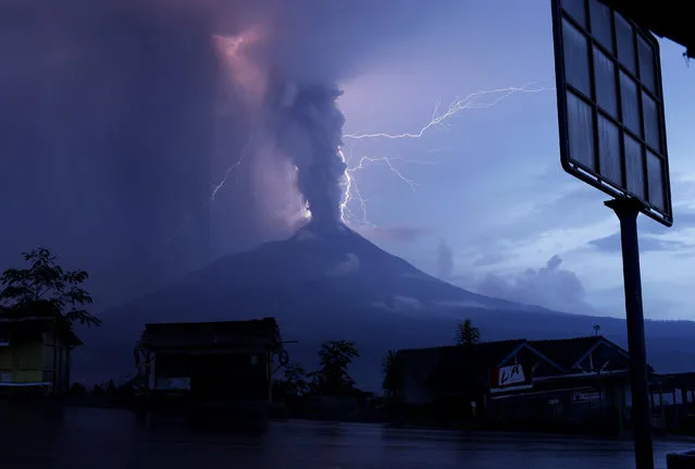 Lightning strikes as Mount Merapi volcano erupts spewing out towering clouds of hot gas and debris, as seen from Ketep village in Magelang, Indonesia's Central Java province November 6, 2010. (Photo by Reuters/Beawiharta)