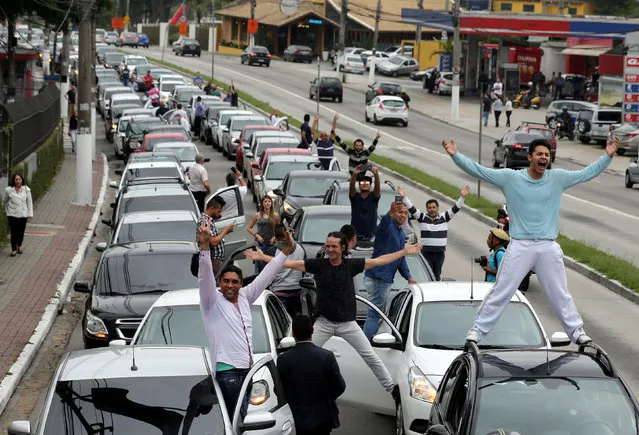 Uber drivers protest against a legislation threatening the company's business model that is to be voted in Brazil's national congress, in Sao Paulo, Brazil October 30, 2017. (Photo by Paulo Whitaker/Reuters)