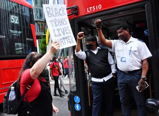 Bus drivers gesture from a bus during a “Black Lives Matter” protest following the death of George Floyd who died in police custody in Minneapolis, London, Britain, June 3, 2020. (Photo by Dylan Martinez/Reuters)