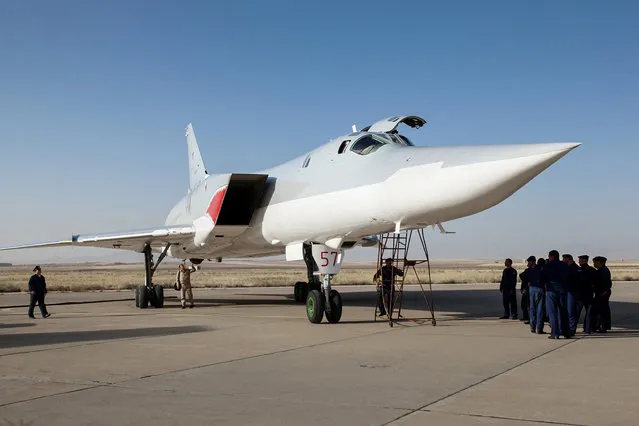 In this photo taken on Monday, Aug. 15, 2016, A Russian Tu-22M3 bomber stands on the tarmac at an air base near Hamedan, Iran. Russian warplanes took off on Tuesday August 16, from Iran to target Islamic State fighters and other militants in Syria, widening Moscow's bombing campaign in Syria.(Photo by WarfareWW Photo via AP Photo)