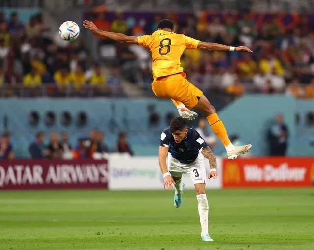 Cody Gakpo of the Netherlands wins a defensive header against Piero Hincapie of Ecuador during the Group A – FIFA World Cup Qatar 2022 match between Netherlands and Ecuador at the Khalifa International Stadium on November 25, 2022 in Doha, Qatar. (Photo by Siphiwe Sibeko/Reuters)