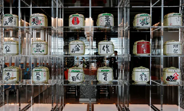 Sake barrels are displayed at a hotel bar in Tokyo, Japan July 19, 2016. (Photo by Toru Hanai/Reuters)