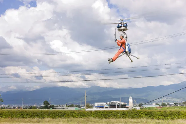 This isn't just any little helicopter – it's the littlest helicopter in the world. The GEN H-4 from Japan's Gen Corporation has a rotor length of just 13 feet and weighs only 154 pounds. Guinness World Records 2011. Location: Matsumoto City, Japan. (Photo by Shinsuke Kamioka/Guinness World Records)