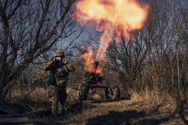 Ukrainian soldiers fire French MO-120-RT-61 120 mm rifled towed mortar at Russian positions in the frontline near Bakhmut, Donetsk region, Ukraine, Tuesday, December 6, 2022. (Photo by LIBKOS/AP Photo)