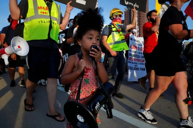 Demonstrators against racial injustice march to the site of the Democratic National Convention (DNC), which is mostly virtual, due to the coronavirus disease (COVID-19) outbreak, in Milwaukee, Wisconsin, U.S., August 20, 2020. (Photo by Brian Snyder/Reuters)