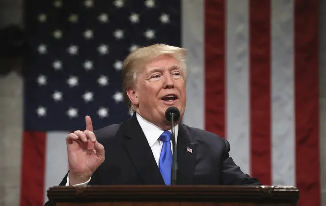 President Donald Trump delivers his first State of the Union address in the House chamber of the U.S. Capitol to a joint session of Congress Tuesday, January 30, 2018 in Washington. (Photo by Win McNamee/Pool via AP Photo)