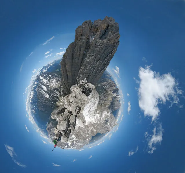 “Taken at the tiny summit of Cima Piccola in the the Tre Cima group in the Dolomites, Italy. The large peak is Cima Grande Some remote peaks have a summit register, and my climbing partner Steve can be seen signing this in the bottom of the picture”. (“Little Planets” Project. Photo and comment by Dan Arkle)