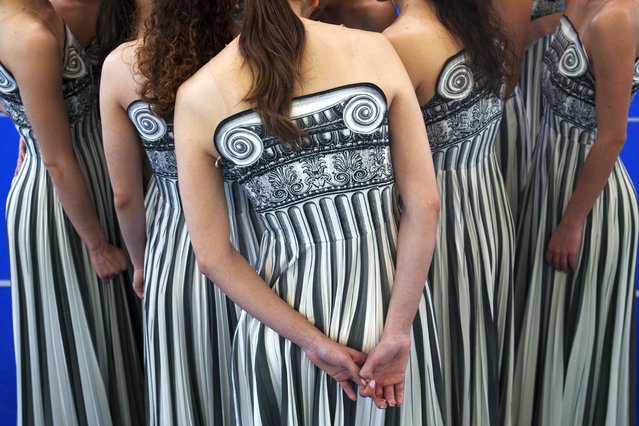 Performers dressed as priestesses attend a practice for the Paris Olympic flame-lighting ceremony, in Athens, Greece, March 30, 2024. The flame for this summer's Paris Olympics is lit at the birthplace of the ancient Olympic Games in southern Greece in a meticulously choreographed ceremony. (Photo by Petros Giannakouris/AP Photo)