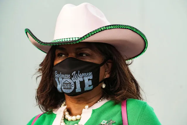 Deirdre Barrett wears a protective mask as she waits in line to cast her ballot for the upcoming presidential election as early voting begins in Houston, Texas, U.S., October 13, 2020. (Photo by Go Nakamura/Reuters)