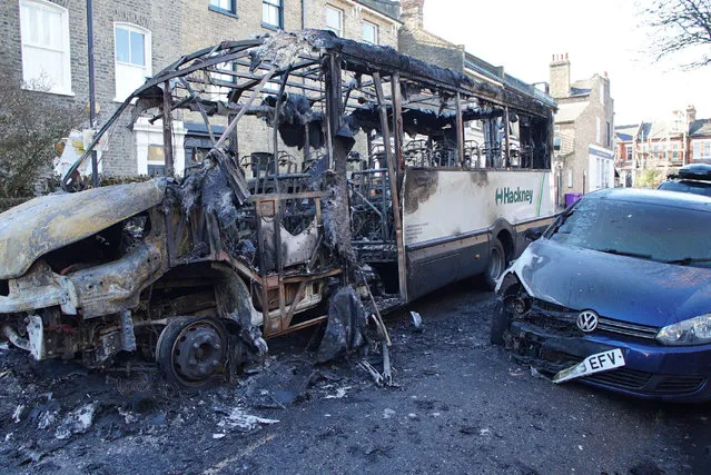 The burnt out remains of a 30-seater bus that was damaged by fire, along with six other vehicles and surrounding properties, on Wilton Way in Hackney, east London on Friday, January 20, 2023. (Photo by Eleanor Cunningham/PA Wire)