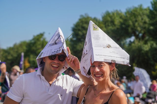 People queuing up for Wimbledon tickets try to keep out of the sun in London, UK on June 30, 2025. (Photo by Amer Ghazzal/Rex Features/Shutterstock)