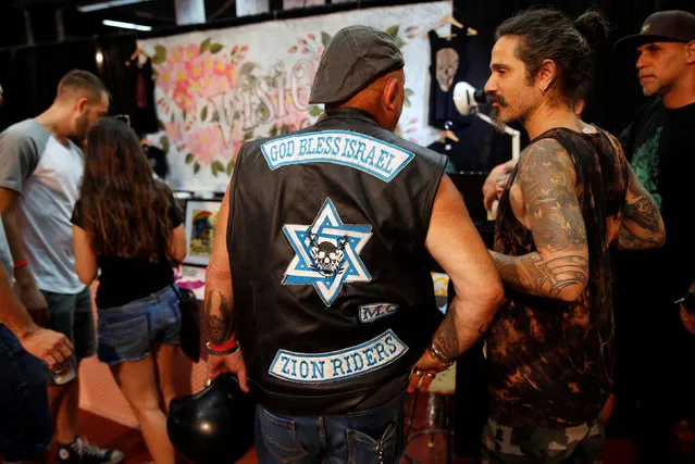 People visit the annual Israel Tattoo Convention in Tel Aviv, Israel, October 8, 2016. (Photo by Baz Ratner/Reuters)