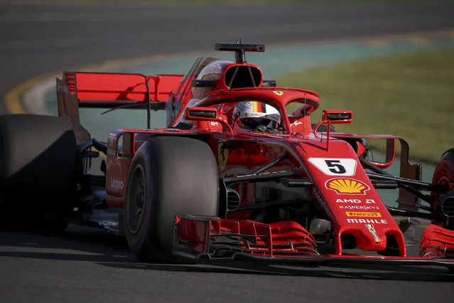 Ferrari driver Sebastian Vettel of Germany drives out of turn 2 during the second practice session at the Australian Formula One Grand Prix in Melbourne, Friday, March 23, 2018. The first race of the 2018 seasons is on Sunday. (Photo by Rick Rycroft/AP Photo)