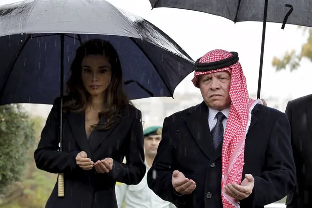 Jordan's King Abdullah II (R) and his wife Queen Rania (L) recite the Fatiha or the prayer of the dead as they lay a wreath during a memorial service for the victims of the 2005 Amman bombings, in the capital November 9, 2015. At least 53 people were killed and 120 wounded on November 9, 2005 in blasts that rocked three hotels in the Jordanian capital. (Photo by Khalil Mazraawi/Reuters)