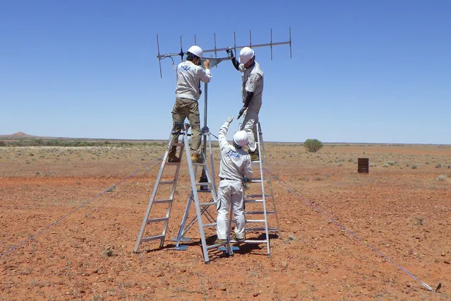 In this photo provided by JAXA, its crew members set up antenna in the preparation for the operation for the capsule collection in Woomera, South Australia in November, 2020. The Hayabusa2 spacecraft left the asteroid Ryugu, about 300 million kilometers (180 million miles) from Earth, a year ago and is expected to reach Earth and drop a capsule containing the precious samples in southern Australia on Dec. 6. (Photo by JAXA via AP Photo)