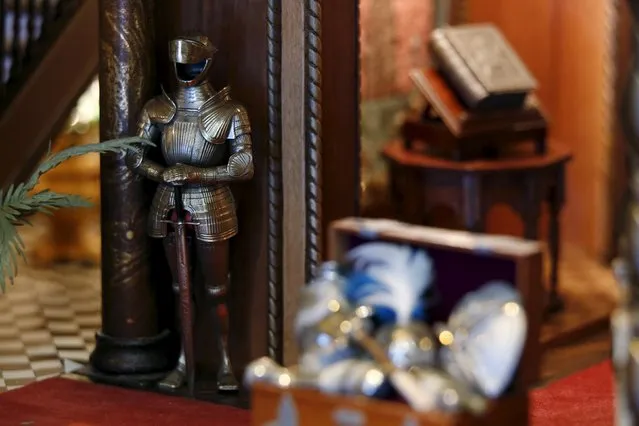 A suit of armor and bible are shown in the "trophy room" of the Astolat Castle, a 3 metre (9 foot) tall dollhouse, currently on display in New York November 14, 2015. (Photo by Lucas Jackson/Reuters)