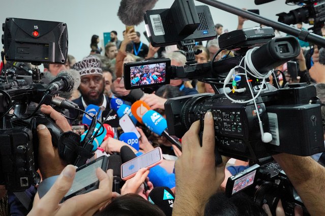 Mohamed Adow, director of the think tank Power Shift Africa, is visible on a camera as he speaks to the media during the COP29 U.N. Climate Summit, Saturday, November 23, 2024, in Baku, Azerbaijan. (Photo by Peter Dejong/AP Photo)